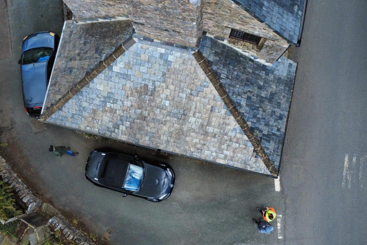 An overhead drone photograph looking straight down onto a slate roof