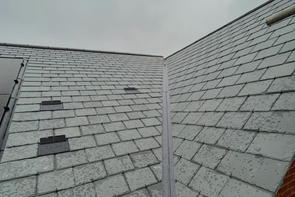 A slate roof with a new lead valley and slate vents fitted